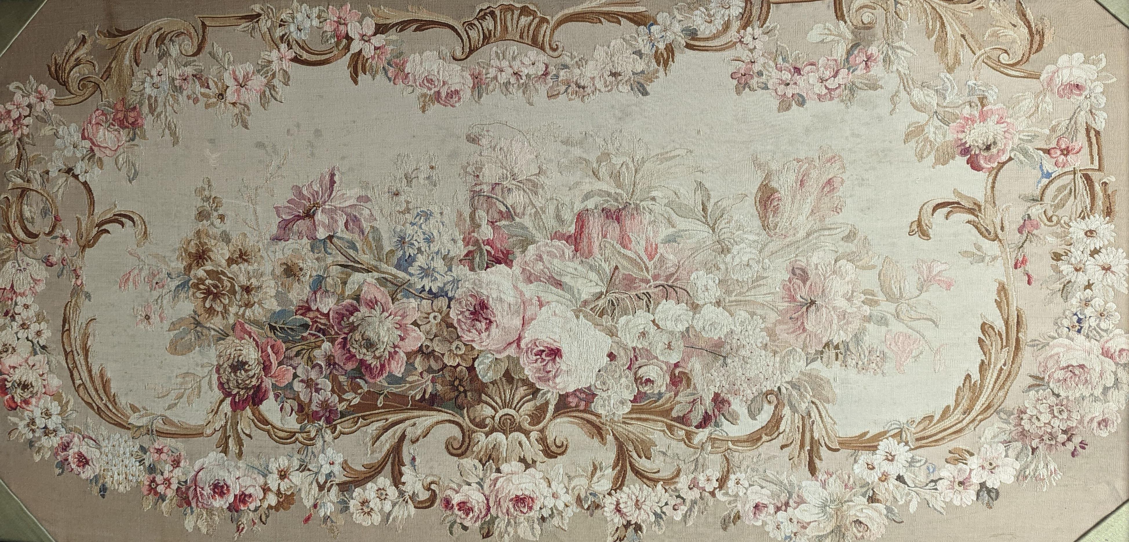 A rectangular oak framed floral tapestry panel 75x147cm